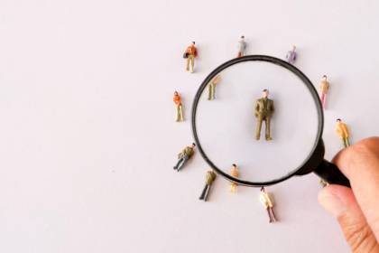 magnifying glass over human figures