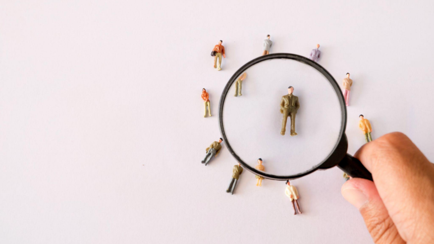 magnifying glass over human figures